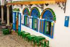 Outdoor cafe along a narrow street in the Bab Haha district of Kasbah, Old Medina, Tangier, Morocco Art Print
